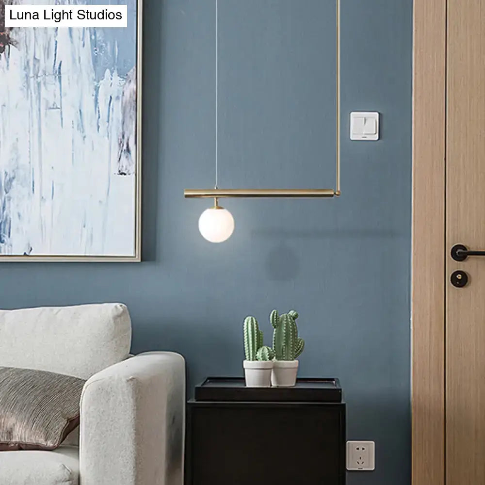 Minimalist brass ceiling light with frosted white glass globe for kitchen island modern globe glass island lighting