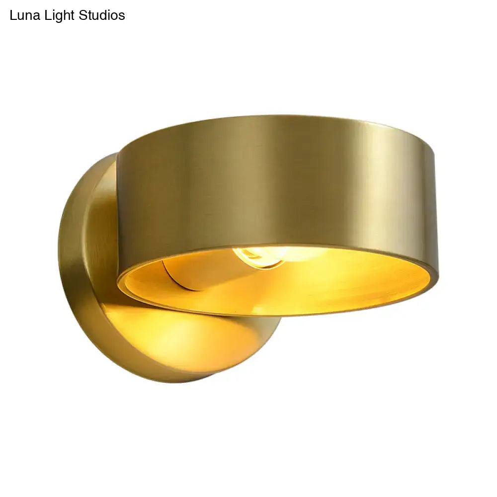 Minimalist brass curved wall lamp with brass finish and warm glowing interior suitable for 110v-120v or 220v-240v use