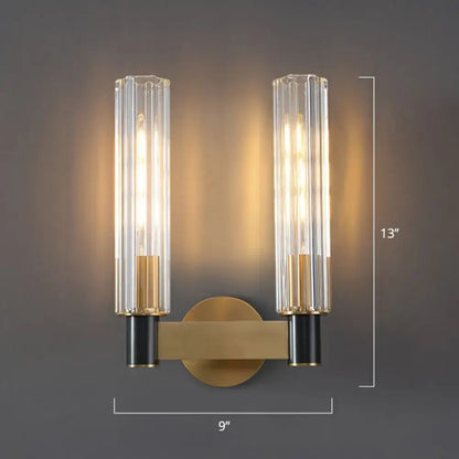 Minimalist brass finish tubular wall light sconce with clear ribbed glass shades for bedroom lighting