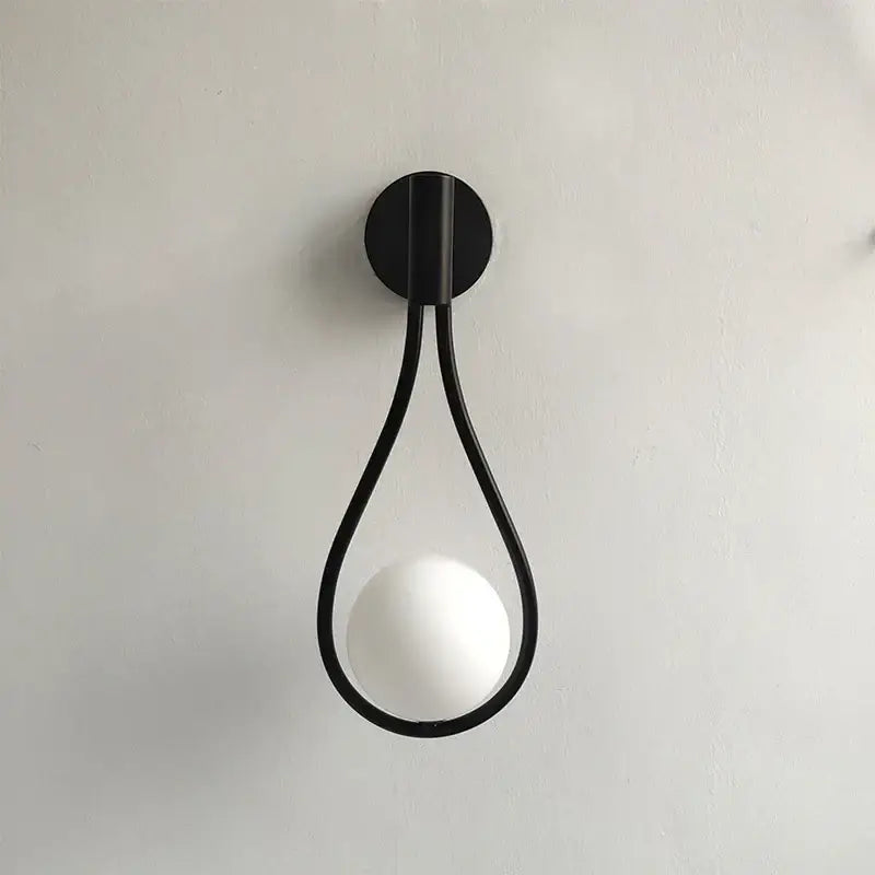 Black metal teardrop wall sconce with white glass ball bulb decorbites brass glass ball wall light for living room decor