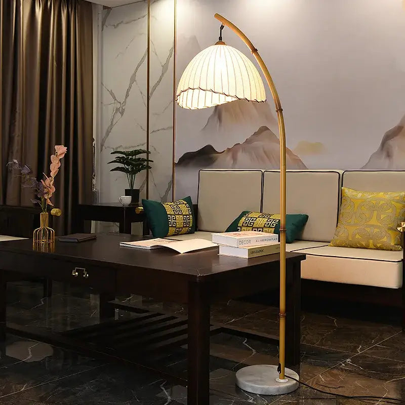 Minimalist brass led floor lamp with golden bamboo-style design, pleated white shade, and marble base for living room