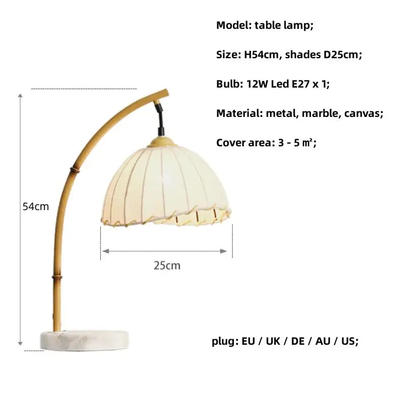 Minimalist brass led floor lamp with cream canvas ruffled lampshade on arched bamboo metal arm and marble base