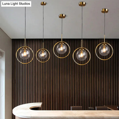 Minimalist Brass Plated Ball Drop Pendant Light with Clear Glass and Ring Decoration