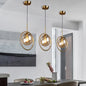 Minimalist Brass Plated Ball Drop Pendant Light with Clear Glass and Ring Decoration