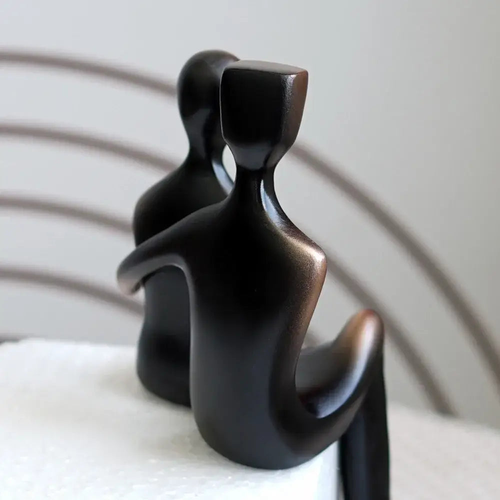 Black glossy resin couple sculptures featuring two abstract seated figures for decorbites elegant resin bedroom decor