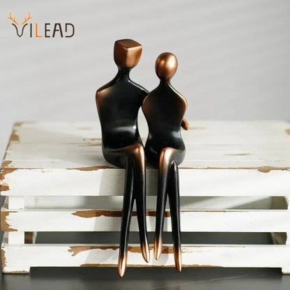 Minimalist bronze and black resin couple sculptures with smooth stylized forms for elegant resin decorbites bedroom decor