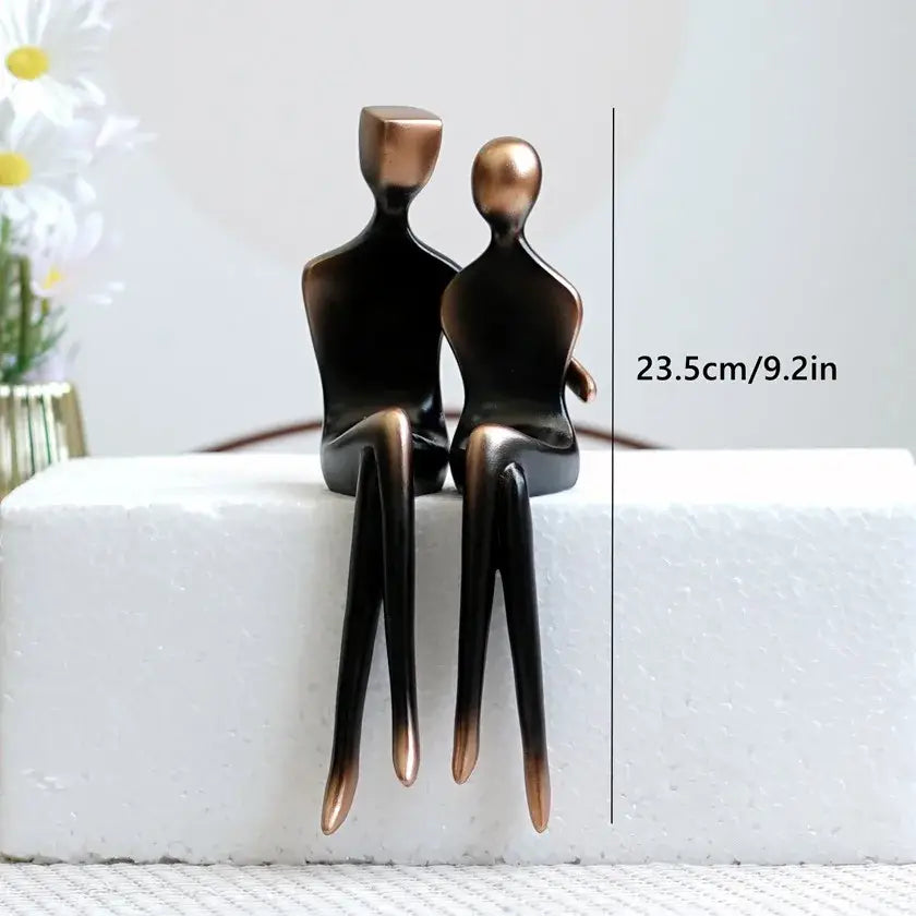 Minimalist bronze and black resin couple sculptures with sleek abstract design for elegant resin decorbites bedroom decor