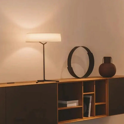Modern minimalist floor lamp with a sleek black metal frame and white fabric shade italian design decorbites