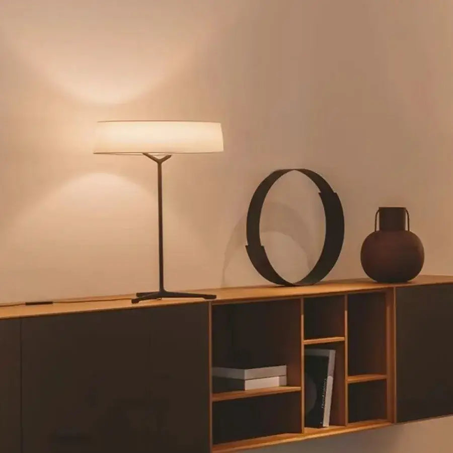 Modern minimalist floor lamp with a sleek black metal frame and white fabric shade italian design decorbites