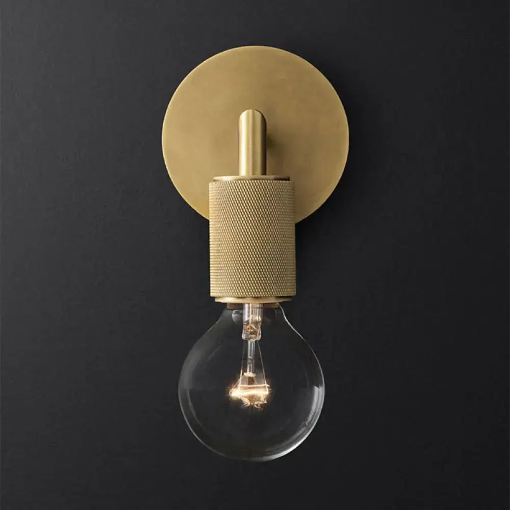 DecorBites™ minimalist bronze wall sconce with brass finish, textured stem, and clear glass shade light bulb