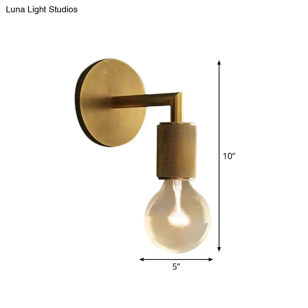Brass-finished decorbites minimalist wall sconce with textured cylindrical accent and exposed light bulb with glass shade options