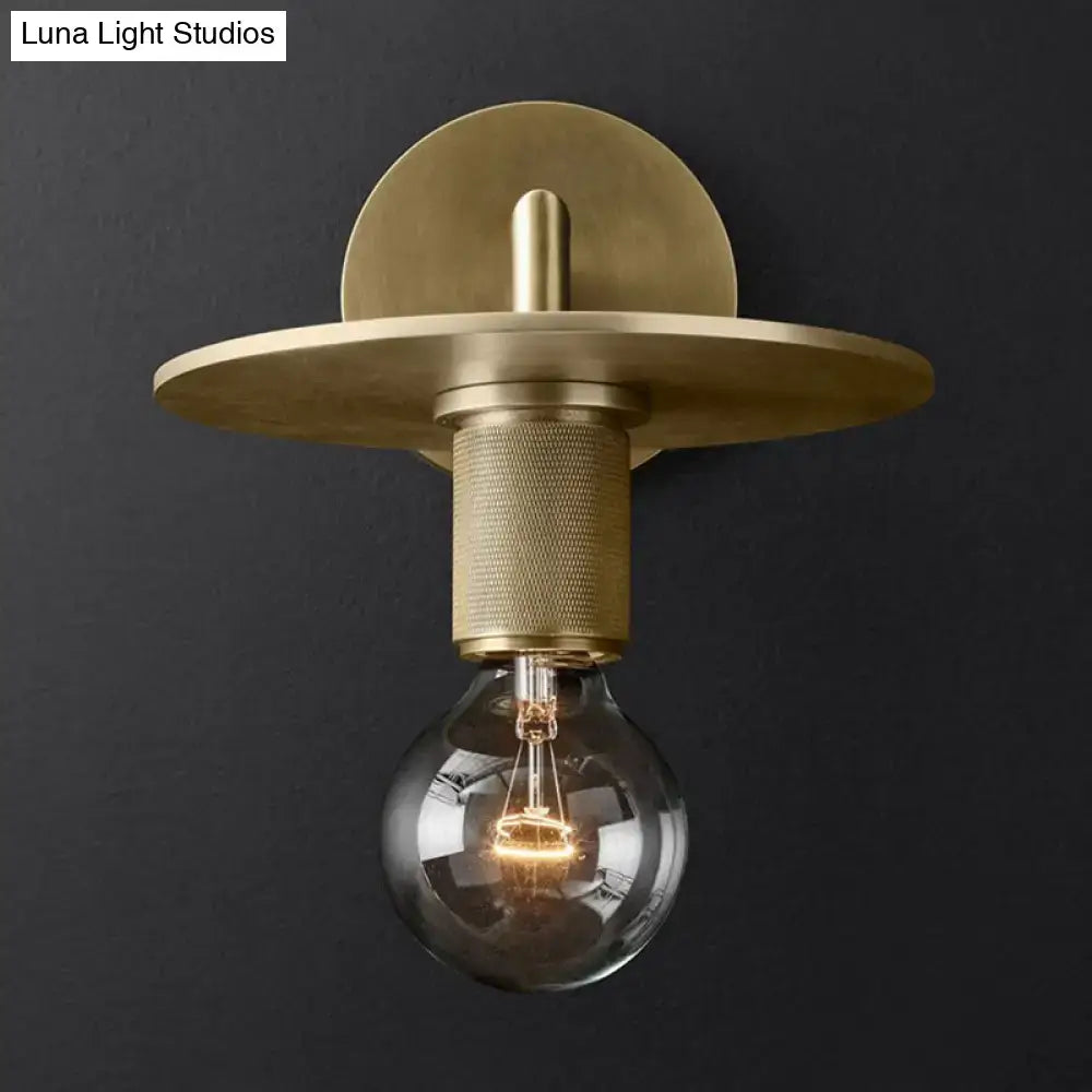 DecorBites minimalist bronze wall sconce with brass finish, textured cylindrical stem, exposed light bulb, and glass shade options