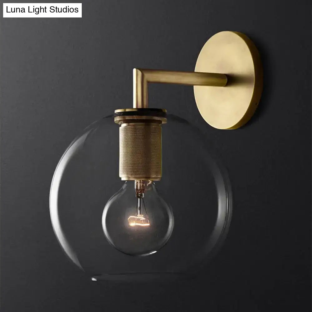 Decorbites minimalist bronze wall sconce with brass finish clear glass shade and exposed light bulb for elegant lighting