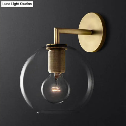 Decorbites minimalist bronze wall sconce with brass finish clear glass shade and exposed light bulb for elegant lighting