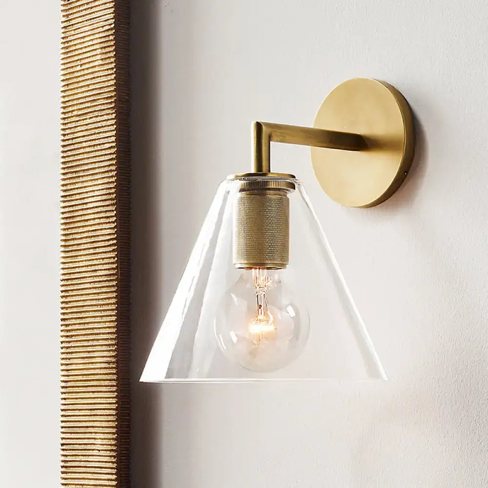 DecorBites™ minimalist bronze wall sconce with a glass shade and exposed light bulb for modern lighting