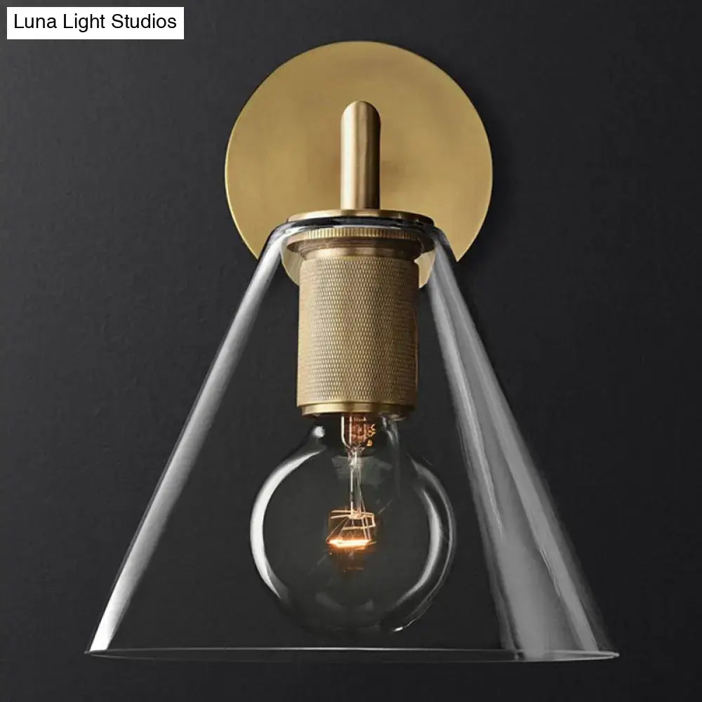 DecorBites™ minimalist bronze wall sconce with brass finish clear glass shade and exposed light bulb filament design
