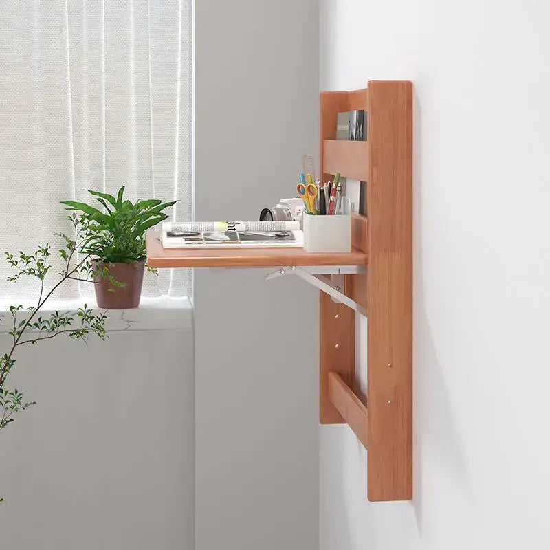 Light brown wooden wall-mounted foldable decorbites compact corner desk with slanted surface and integrated shelves