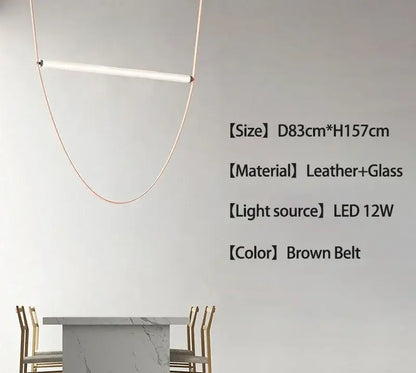 Minimalist brown leather hanging clothes drying rack with brown leather and glass pendant lamp and copper pendant light frame