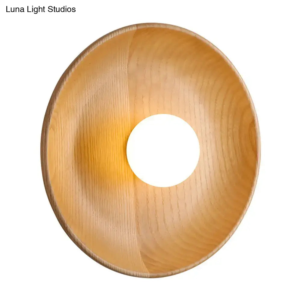 Minimalist brown wood wall light with light wood-finished bowl and circular cutout featuring fixture height design