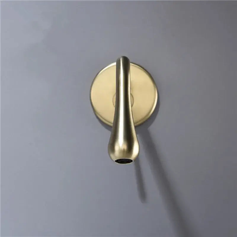 A minimalist brushed gold basin faucet wall mounted tap with a sleek teardrop design by decorbites brushed gold