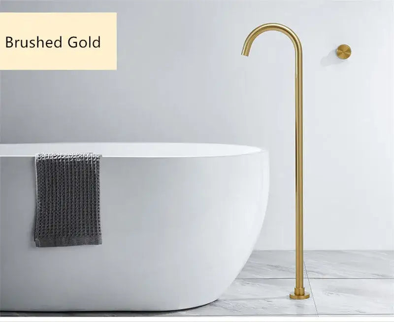 Minimalist brushed gold freestanding bathtub shower faucet with sleek curved spout and black accents for modern bathrooms