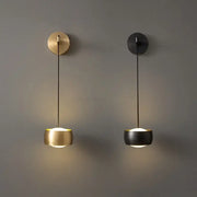 Two minimalist pendant wall lamps in brushed gold and matte black with cylindrical shades for bedroom reading light decorbites copper adjustable wall