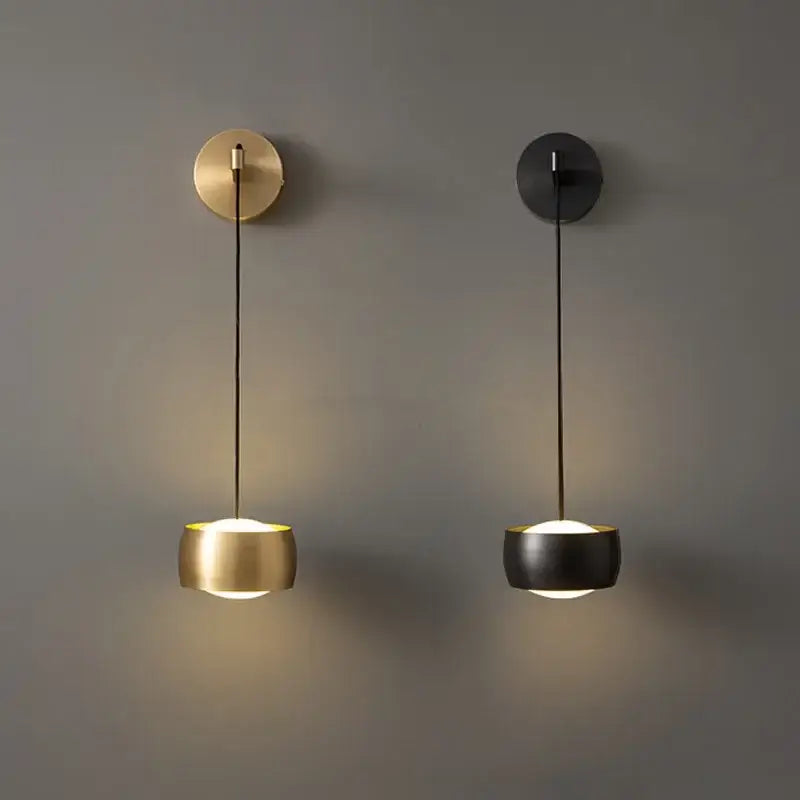 Two minimalist pendant wall lamps in brushed gold and matte black with cylindrical shades for bedroom reading light decorbites copper adjustable wall