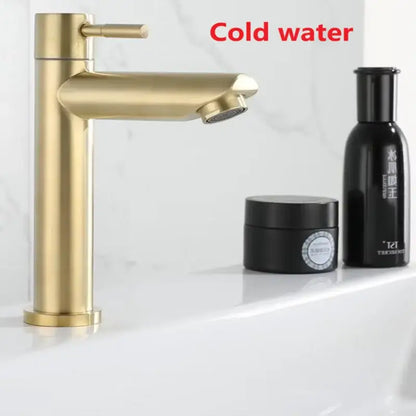 Minimalist brushed gold stainless steel single hole bathroom faucet with gold-toned single handle and sleek modern design