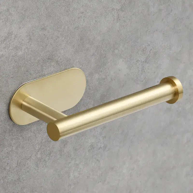 Minimalist tissue holder with brushed gold stainless steel finish and sleek cylindrical design for bathroom use