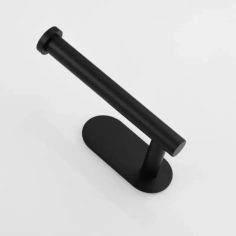 Black matte tissue holder with sleek modern design contrasting minimalist brushed gold stainless steel bathroom stand
