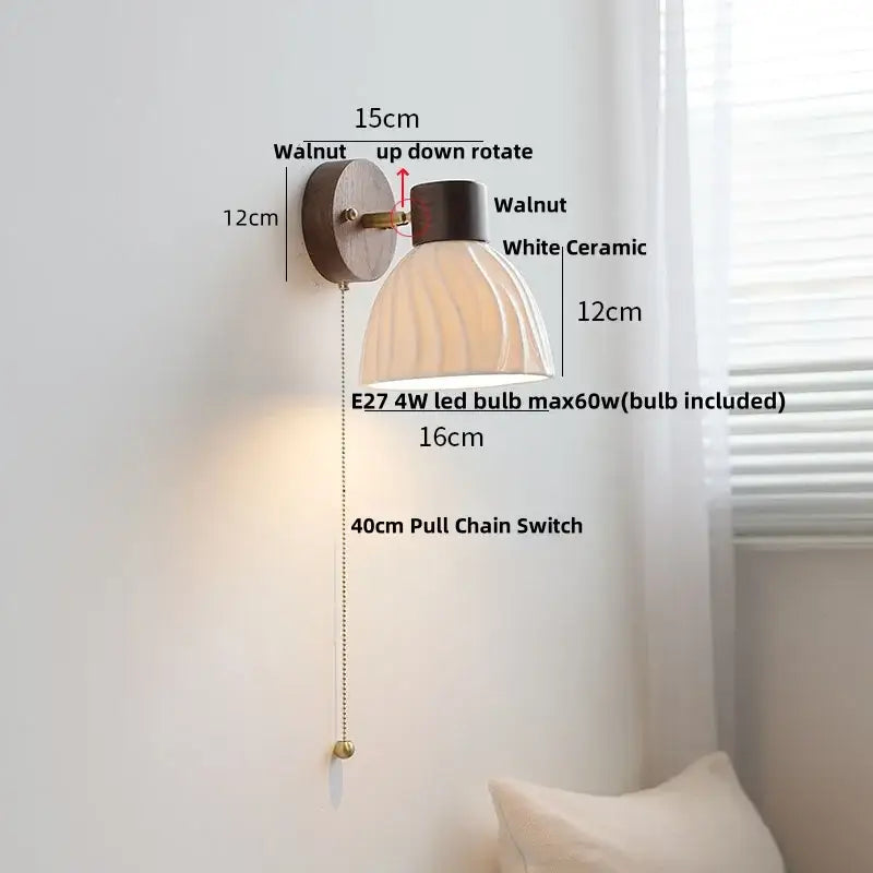 Minimalist ceramic walnut wood wall light featuring a walnut finish with white ceramic ribbed shade and brass pull chain switch