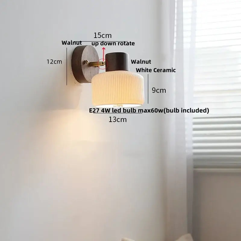 Minimalist ceramic walnut wood wall light with walnut finish, white ribbed ceramic shade, and black cylindrical top for reading
