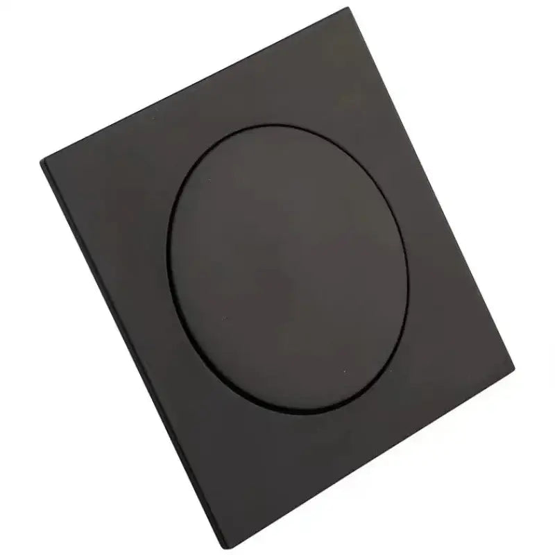 Black matte square flush mount ceiling light with circular recessed design paired with decorbites brass anti odor floor drain