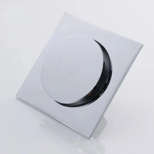 Minimalist chrome square brass anti odor floor drain with sleek circular opening for bathroom use by decorbites brass anti