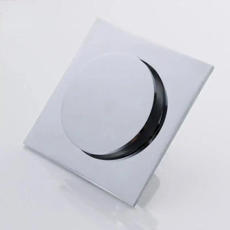 Minimalist chrome square brass anti odor floor drain with sleek circular opening for bathroom use by decorbites brass anti