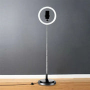 Silver minimalist circular metal mobile phone vanity light with adjustable stand and 110v-120v power for bedroom use