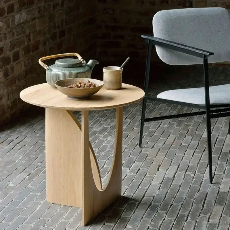 Minimalist circular walnut wood coffee table with light wood finish and curved sculpted legs for living room decorbites circular walnut