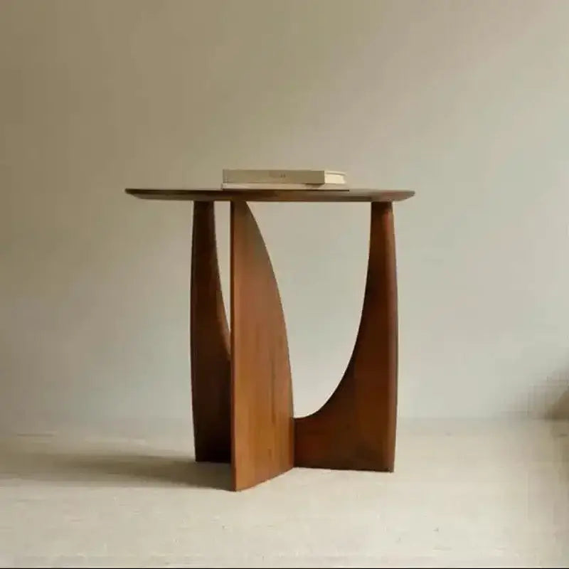 Minimalist circular walnut wood coffee table with a sleek curved base and smooth finish for living room decorbites circular walnut