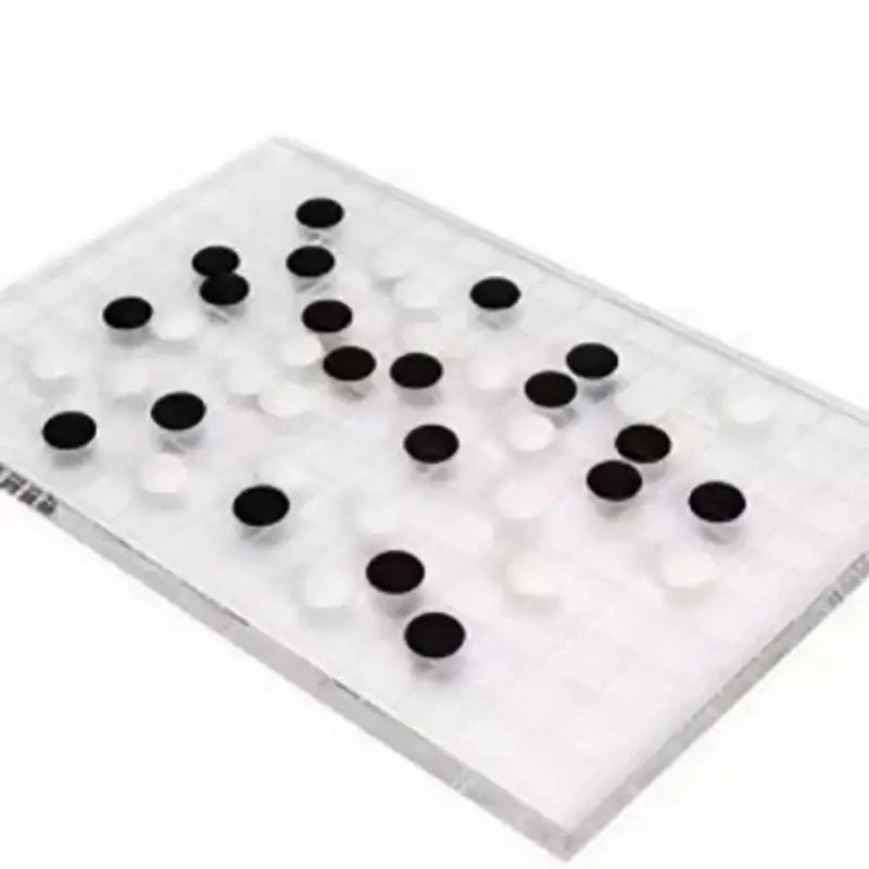 Minimalist clear geometric chess set with acrylic board and black and white stones for modern decorbites geometric chess decor