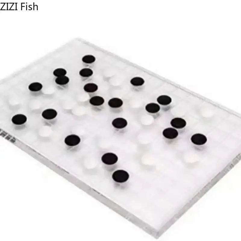 Minimalist clear geometric chess set with black and white circular pieces on acrylic board for elegant decorbites decor