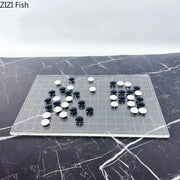 Clear acrylic go board with black and white stones as a minimalist decorbites geometric chess set for living room decor