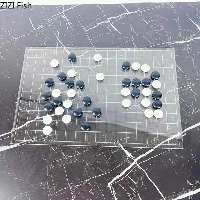 Clear acrylic go board with black and white stones as a decorbites geometric chess set minimalist living room decor