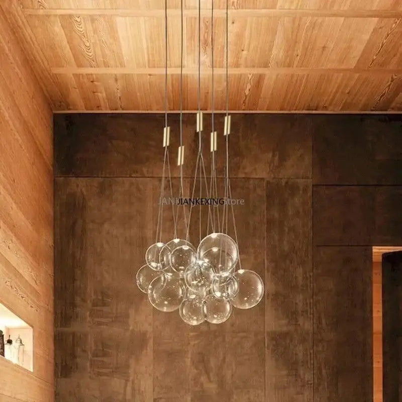 Minimalist clear glass bubble led pendant light with brass accents for dining room decorbites glass bubble design
