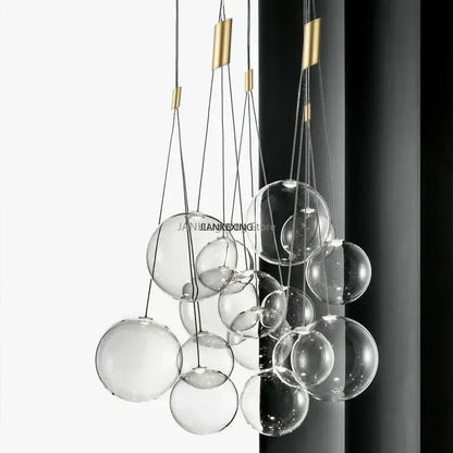 Minimalist clear glass bubble led pendant light with gold-toned metal accents for dining room decorbites glass bubble