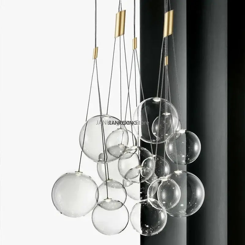 Minimalist clear glass bubble led pendant light with gold-toned metal accents for dining room decorbites glass bubble