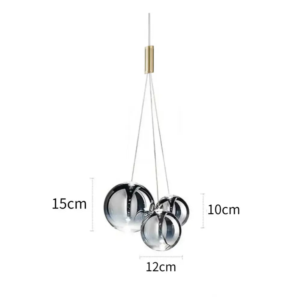 Modern chrome finished glass bubble led pendant light with brass accent and thin cables for dining room decorbites glass bubble