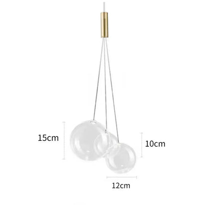 Minimalist clear glass bubble led pendant light with two transparent spheres and polished brass fixture for dining room decorbites glass bubble