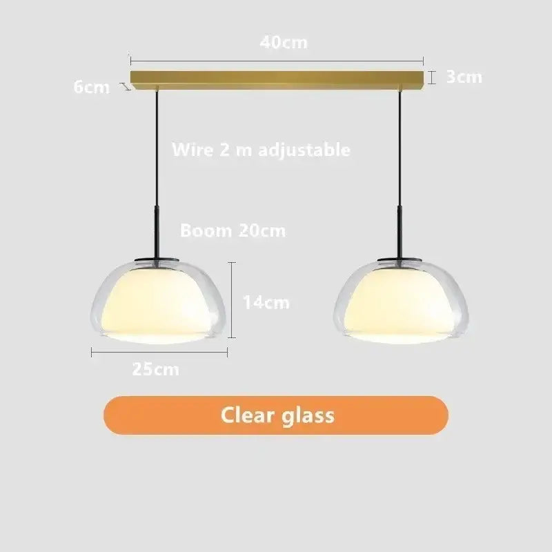 Modern minimalist jelly pendant lamp with clear glass domes and brass-finished bar for living room lighting