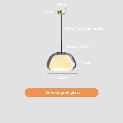 Minimalist jelly pendant lamp with sleek smoke gray glass shade and brass ceiling mount for living room use