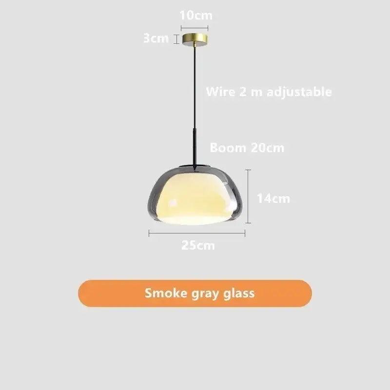 Minimalist jelly pendant lamp with sleek smoke gray glass shade and brass ceiling mount for living room use